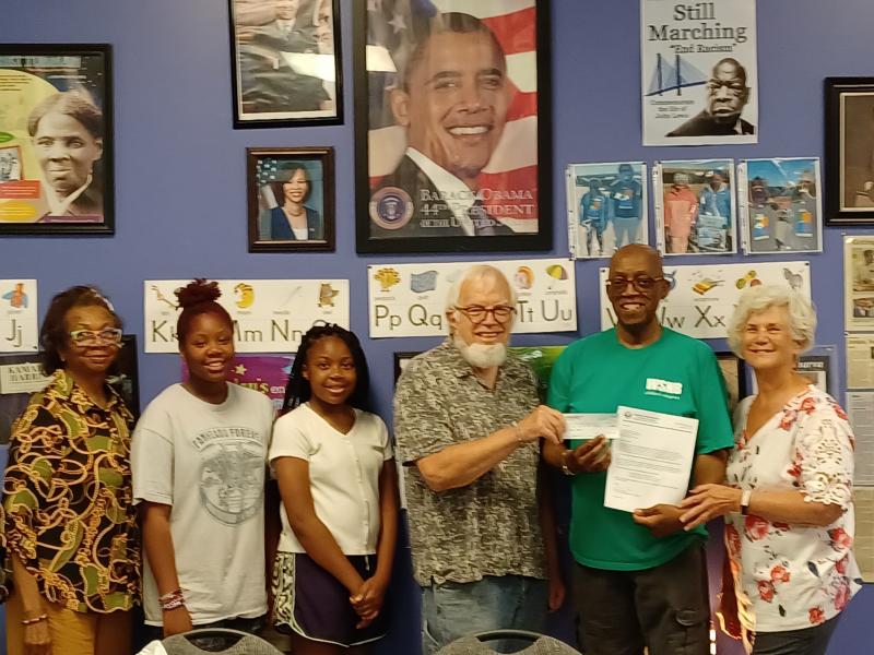 Gathered for the West Side New Beginnings check presentation are (l-r) Brenda Milbourne, co-founder and executive director; Kendall Deshields, and Cameron Winston, West Side New Beginnings; Mac Goekler, UUSD social and environmental justice committee; Diaz Bonville, West Side New Beginnings, co-founder and president; and Jan Daily, UUSD. SUBMITTED PHOTOS